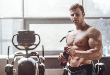 Man doing resistance band workout for lean muscle gain in a home gym