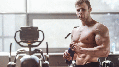 Man doing resistance band workout for lean muscle gain in a home gym