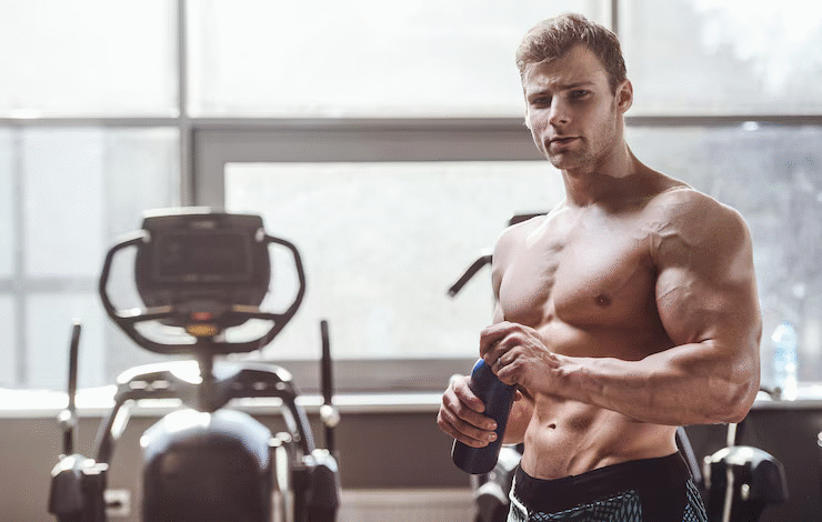 Man doing resistance band workout for lean muscle gain in a home gym